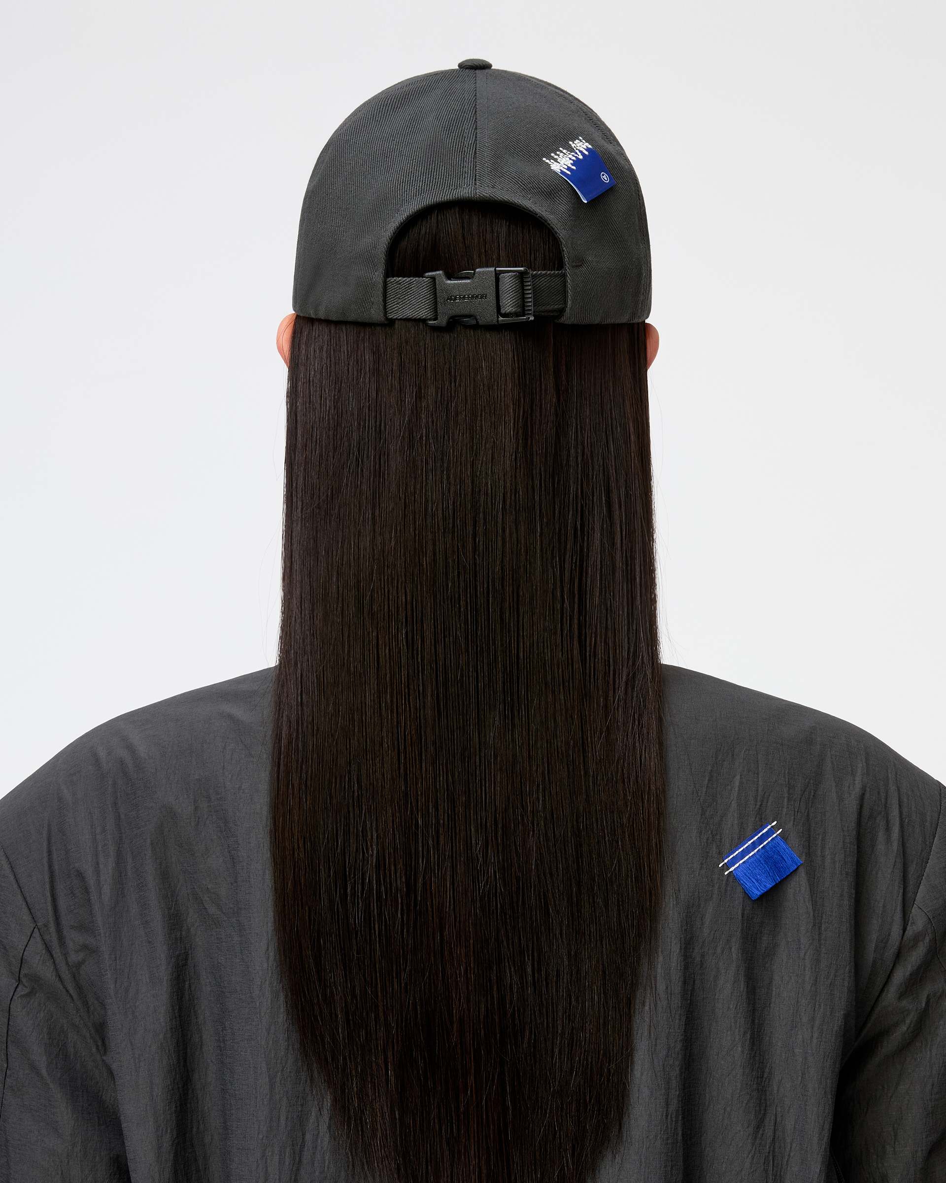 ADER A Cap in Charcoal — model wearing, rear view