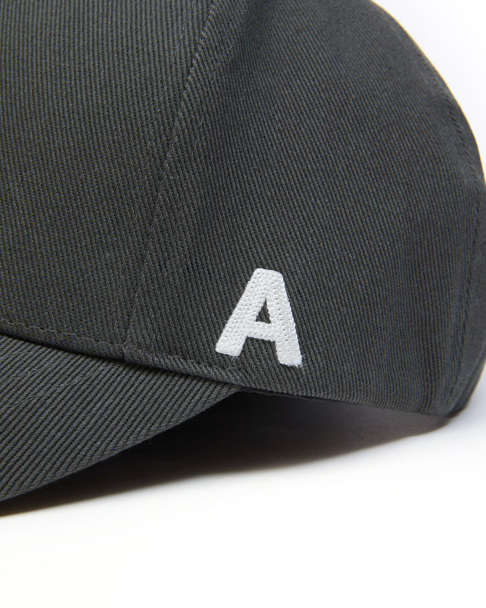 ADER A Cap in Charcoal — A logo embroidery close-up